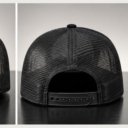 Rear view of black corduroy trucker snapback on a clean studio background
