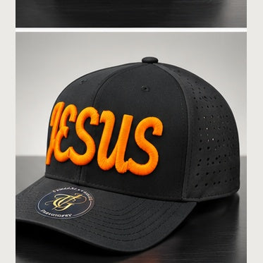 Angled black perforated snapback with orange Jesus Script 3D puff embroidery on a clean studio background