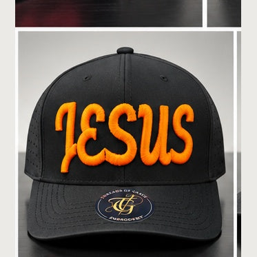 Black perforated snapback with orange Jesus Script 3D puff embroidery on a clean studio background