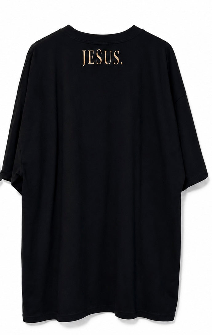 Back view of black AS Colour T-shirt with antique gold JESUS neckline print