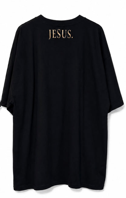 Back view of black AS Colour T-shirt with antique gold JESUS neckline print