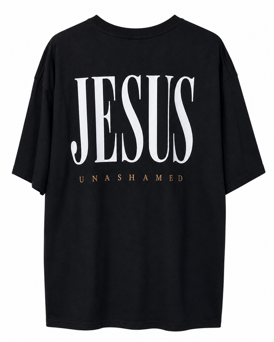 Back view of black AS Colour Heavy T Shirt with bright white JESUS UNASHAMED full back design on white background